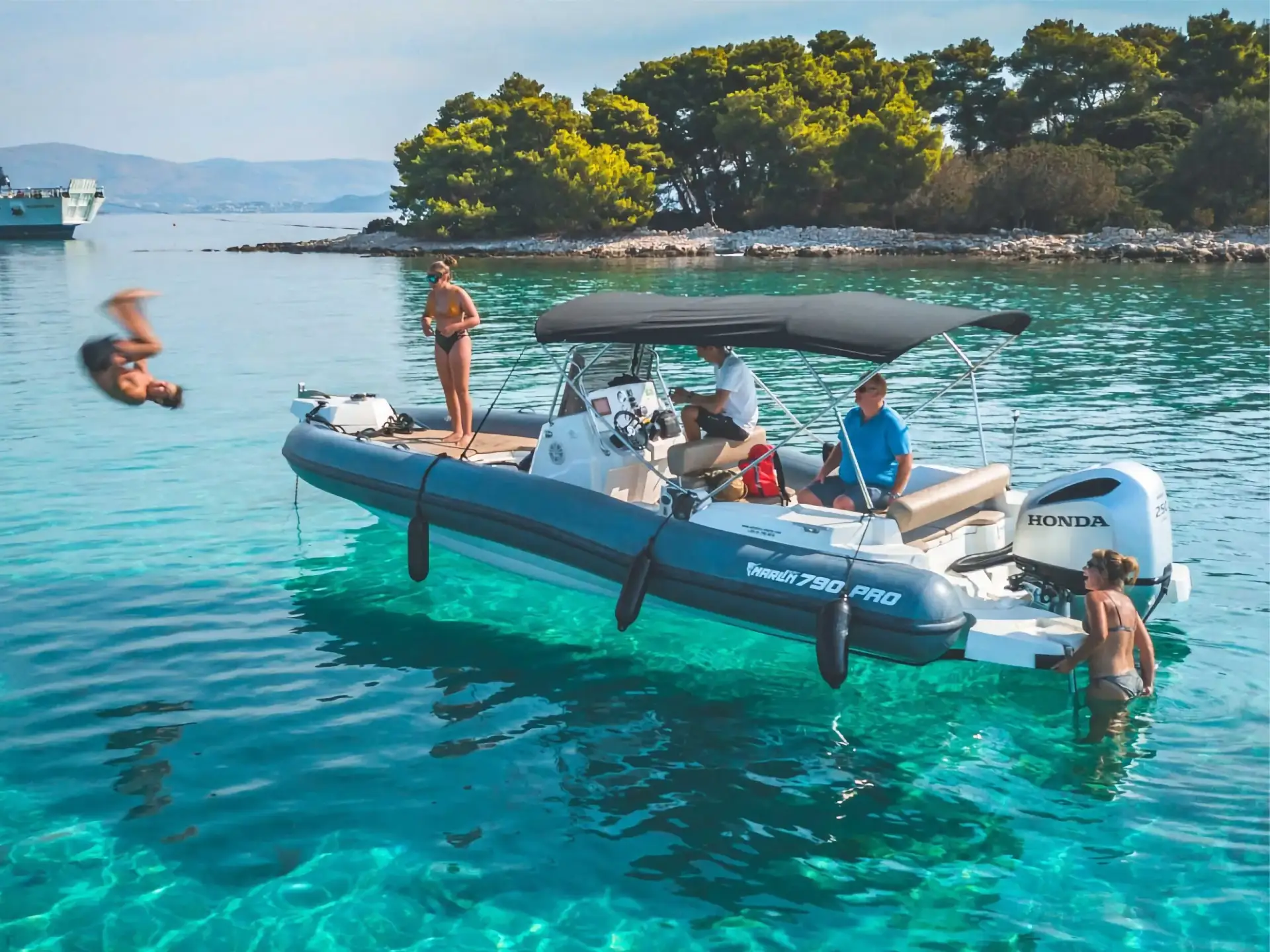 Guests enjoying a boat trip in crystal clear waters near Pakleni Islands